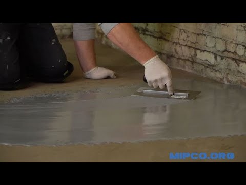 applying fast rock floor repair on a concrete floor with a trowel