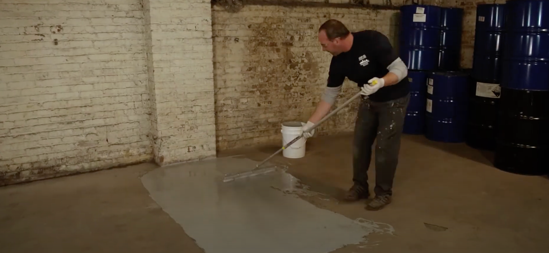 zip crete being applied to a concrete warehouse floor 
